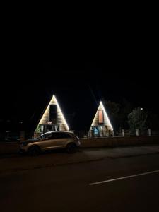 a car parked in front of a house at night at Tara Lux 2 in Mojkovac