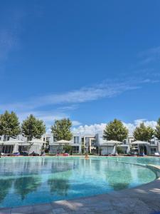 a large swimming pool at a resort at Villa Buki in Lezhë