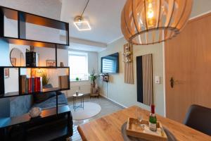 a living room with a table and a dining room at Pension Krone in Freiberg