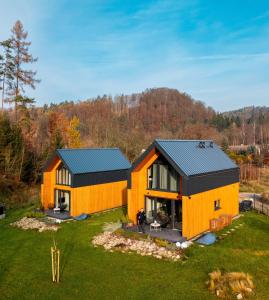 an orange house with a black roof at Hill & Chill Kudowa Zdrój in Kudowa-Zdrój