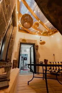 a dining room with a table in a room at Les Cactus #MaisonSavaron in Clermont-Ferrand