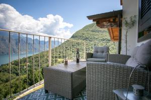 a balcony with a view of a mountain at L'angolo di Fonteno in Fonteno