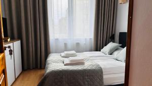 Postel nebo postele na pokoji v ubytování Apartament Dworcowa z widokiem na park