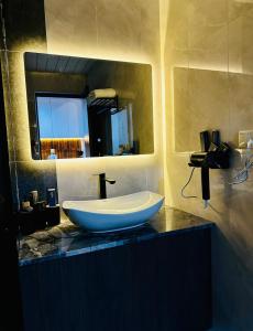 a bathroom with a sink and a mirror at Amber Nest Tsaghkadzor in Tsaghkadzor +33 photos