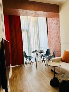 a living room with a couch and chairs and a table at Amber Nest Tsaghkadzor in Tsaghkadzor