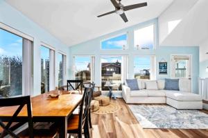 a living room with a table and a couch at Ocean Oasis in Rockaway Beach