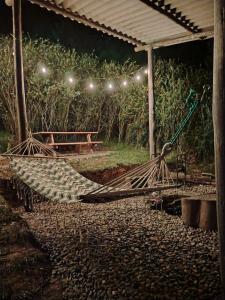 a hammock on the ground under a tent at Sweet Forest- Domo Luna in Punilla +10 photos