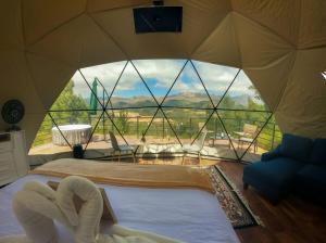 a room with a tent with a large window at Sweet Forest- Domo Luna in Punilla