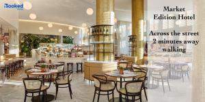 a restaurant with tables and chairs in a room at BEACH VIBES in Miami Beach