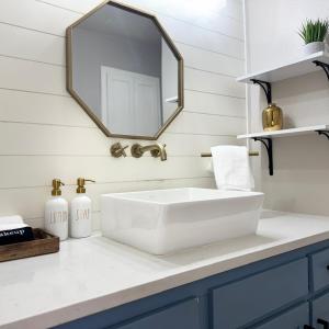 a bathroom with a white sink and a mirror at Raider Retreat-Your TTU Basecamp in Lubbock +27 photos