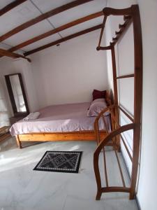 a bedroom with a bed in a room at Relax garden in Sigiriya +11 photos