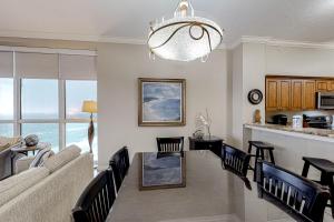 a living room with a couch and a table at Hidden Dunes 1706 in Destin