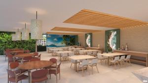 a restaurant with tables and chairs in a room at Flat em muro alto in Ipojuca