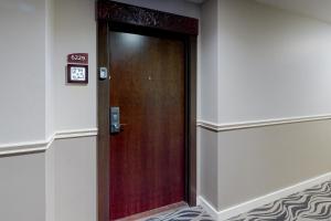 a door in a building with a clock on it at Luau II 6229 in Destin +25 photos