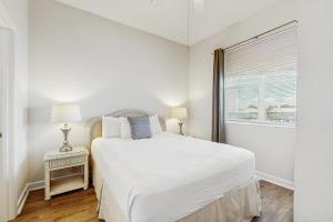 Ένα ή περισσότερα κρεβάτια σε δωμάτιο στο Gulf Place Cabanas 407 +29 φωτογραφίες