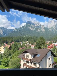 a view of a mountain range from a building at MAROVA LUXURY APARTAMENT Caraiman VIEW in Buşteni