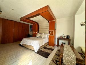 Postel nebo postele na pokoji v ubytování Kiwara Guesthouse