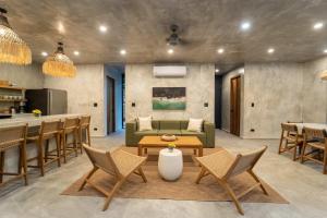 a living room with a couch and a table at Manuel Antonio Tree House VIllas in Quepos