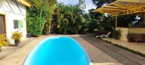 a swimming pool in the backyard of a house at Villa Colibri at LakeGardens in Nuevo Arenal