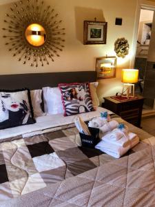 a living room with a bed and a mirror at Residence Cuore in Caserta