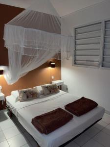 Katil atau katil-katil dalam bilik di Villa Katalpa, Le paradis les pieds dan l'eau