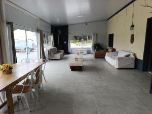 a large living room with a table and a couch at La Martinna 1 in Trinidad