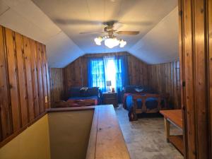 a room with a table and a couch and a window at Chic City Charming Bungalow with all the Amentities Great Family Getaway! in Detroit