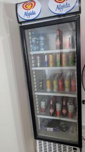 a refrigerator filled with drinks and soda at Vila Kastriotet-Hotel in Lezhë
