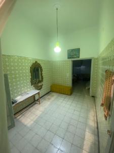 a room with a bathroom with a sink and a mirror at Dar Al Yoser Guest house in Mahdia +9 photos