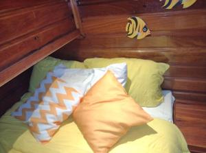 a bed with two pillows on it in a room at IBIZA Escuna in Paraty