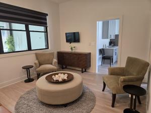 a living room with a couch and chairs and a table at Modern ranch retreat near Trilith and US Soccer Training Facilities in Fayetteville