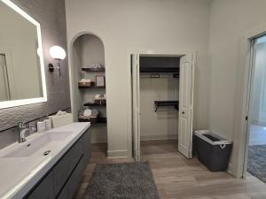 a bathroom with a sink and a mirror at Modern ranch retreat near Trilith and US Soccer Training Facilities in Fayetteville +14 photos
