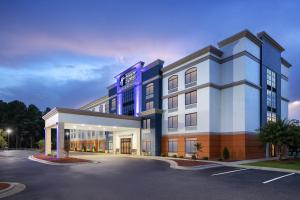 a rendering of a hotel with a parking lot at Holiday Inn Express Fayetteville Fort Bragg by IHG in Fayetteville
