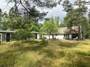 an old house in the middle of a field at 4 person holiday home in DEGEBERGA in Degeberga
