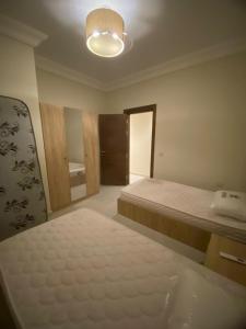 Ένα ή περισσότερα κρεβάτια σε δωμάτιο στο Lavsita ras al hikma