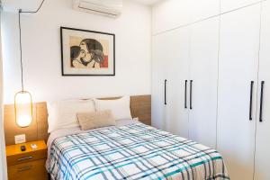 Postel nebo postele na pokoji v ubytování Condomínio Edificio Miramar