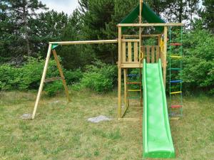 Zona de juegos infantil en Sauna Retreat in Blabjerg - By Traum Ferienwohnungen