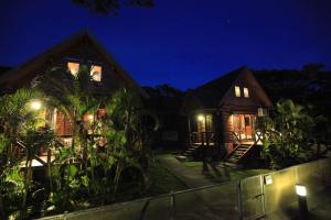 a house at night with the lights on at Tokashiki Guest House in Tokashiki