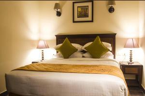 Postel nebo postele na pokoji v ubytování Porto South Beach