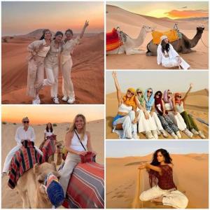 a group of women posing in the desert at Bivouac Camel Trips in Merzouga