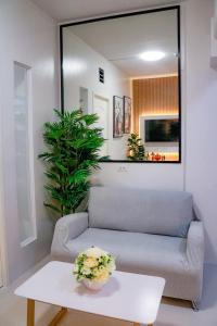 a living room with a couch and a table at Urban Chic Home Urban Chic Home with balcony in Pajo
