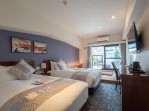 Ένα ή περισσότερα κρεβάτια σε δωμάτιο στο Hotel Tokyo Trip Ueno Nishi Nippori