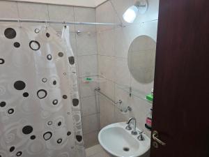 a bathroom with a shower and a sink at El Punto Las Varillas in Las Varillas +5 photos