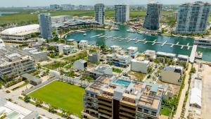 an aerial view of a city with buildings and a harbor at Luxury Penthouse with Private Rooftop in Cancún