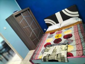 Ένα ή περισσότερα κρεβάτια σε δωμάτιο στο PiXMA HOMESTAY CAMERON HIGHLANDS
