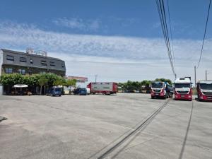 a group of buses parked in a parking lot at Pensión As Rodas in Sarria +1 photo