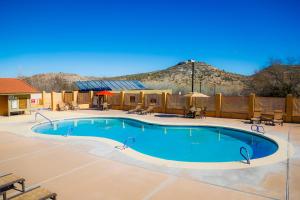 a swimming pool with a mountain in the background at Verde Valley Studio Cabin 1 in Cottonwood