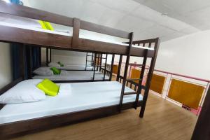 a group of bunk beds in a room at Havendwell Garden Resort in Bokbok +34 photos