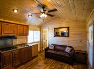 a kitchen with a couch and a ceiling fan at Verde Valley Canyon View Cottage 6 in Cottonwood