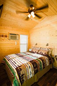 a bedroom with a bed with a ceiling fan at Verde Valley Canyon View Cottage 6 in Cottonwood